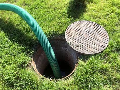 Legend Advanced Septic crew pumping a septic tank on the job